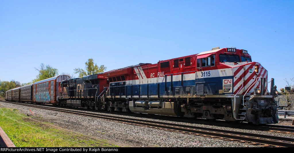 CSX Q434 northbound by the station with CN /BC Rail heritage unit 3115 leading 